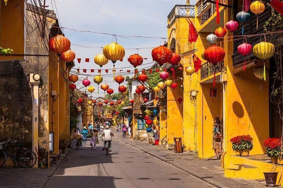 Traditional yellow merchant houses along a historic street in Hoi An