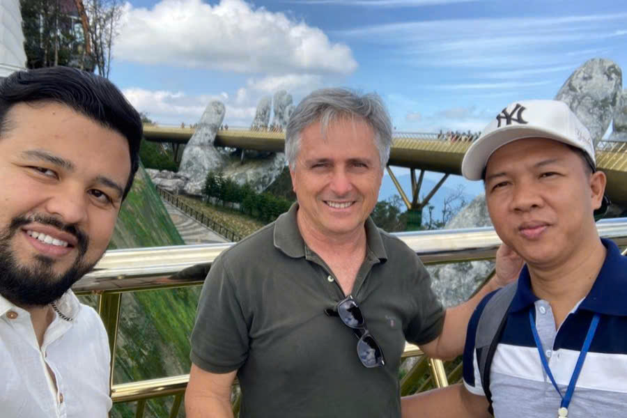 Mr. Viet Nguyen with guests at the Golden Bridge during a Hue Da Nang Hoi An Phong Nha Tour