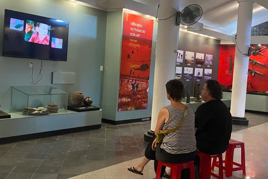 Visitors watching a documentary about the My Lai Massacre at the Son My Memorial Museum in Quang Ngai, Vietnam