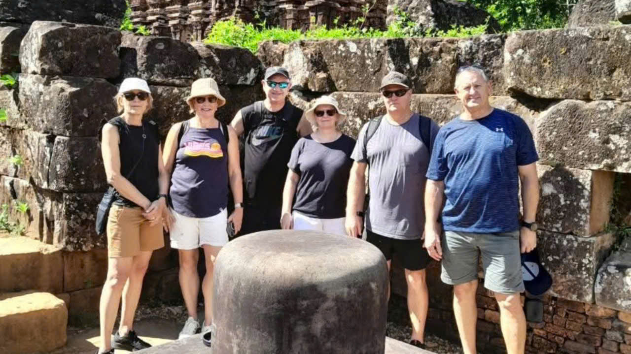Travelers exploring ancient Cham Hindu temples at My Son Sanctuary