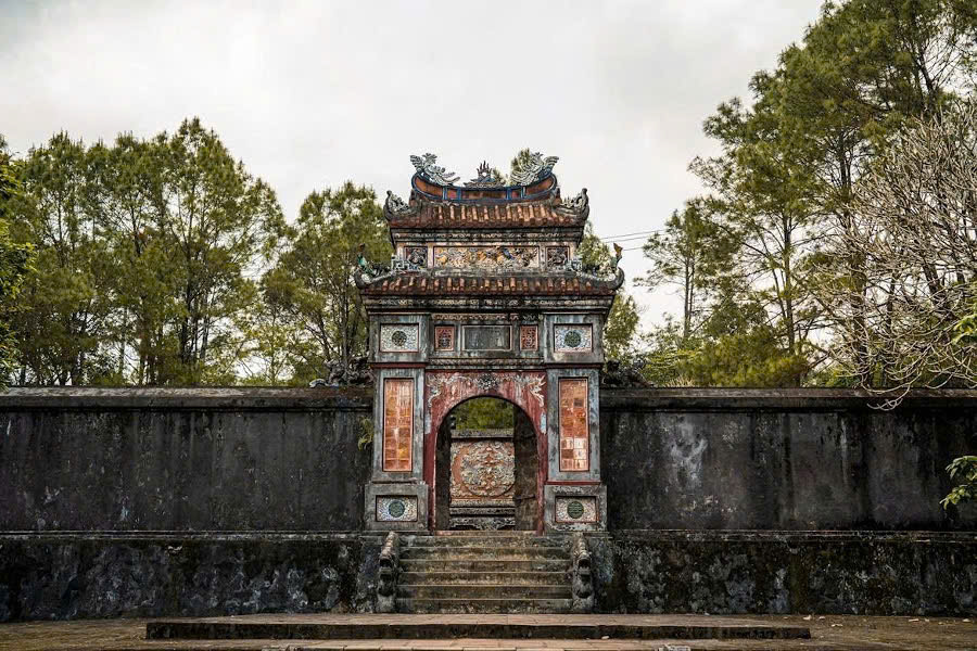 Traditional royal architecture and landscaped grounds at Tu Duc Tomb in Hue