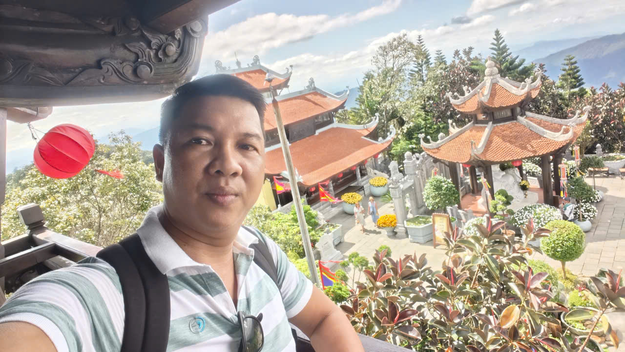 Viet Nguyen takes a selfie at the Bell Tower, the highest point in Ba Na Hills