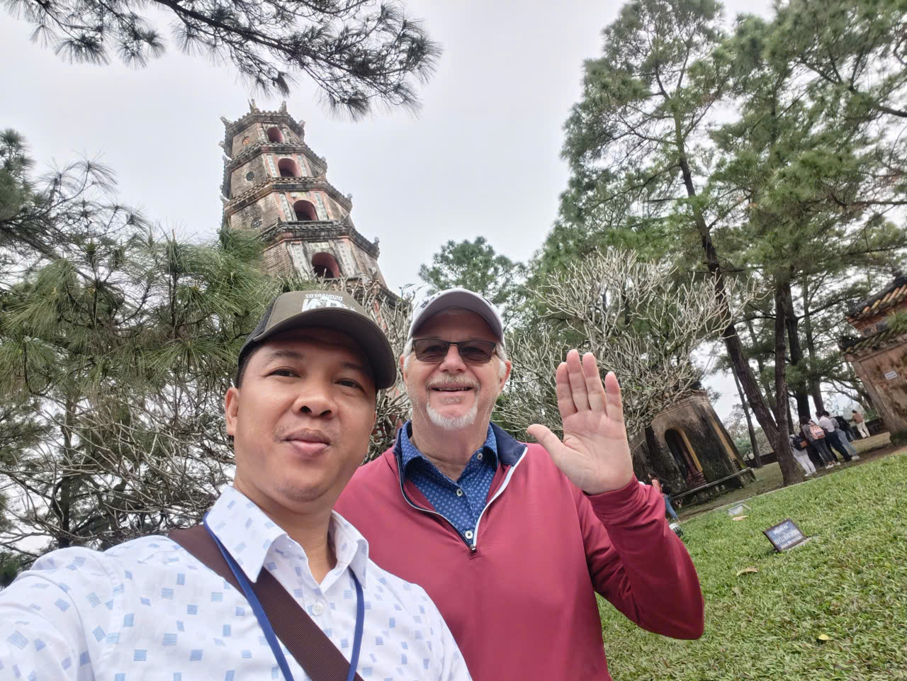 Viet Nguyen taking a selfie with guests at Thien Mu Pagoda, one of Hue's most iconic landmarks