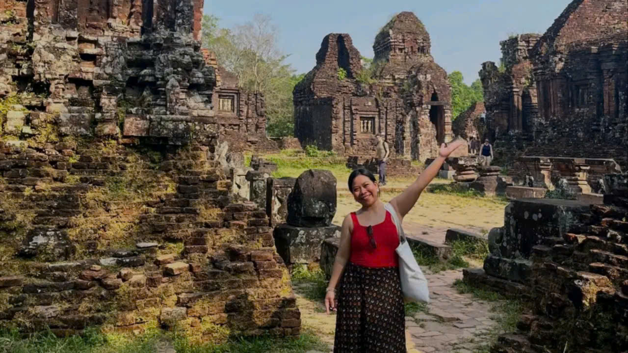 Guests taking photos in front of ancient Hindu temples during a My Son Sanctuary tour in Central Vietnam.