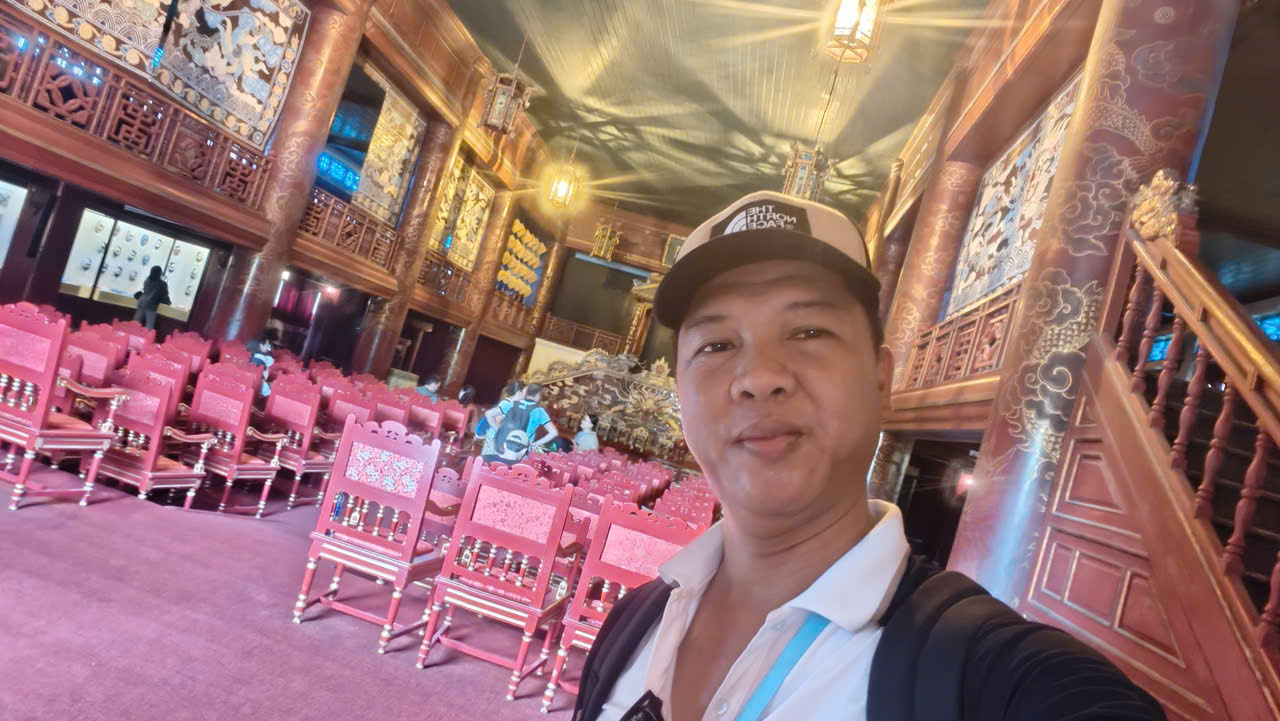 Viet Nguyen taking a selfie inside the Royal Theater (Duyet Thi Duong Royal Theatre) at the Hue Imperial City, Vietnam.