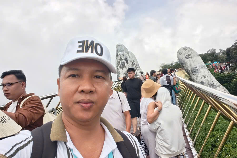 Viet Nguyen at the iconic Golden Bridge in Sun World Ba Na Hills, Da Nang