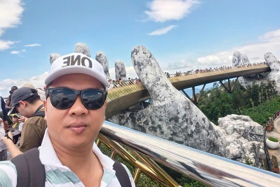 Viet Nguyen taking a selfie at Golden Bridge Ba Na Hills