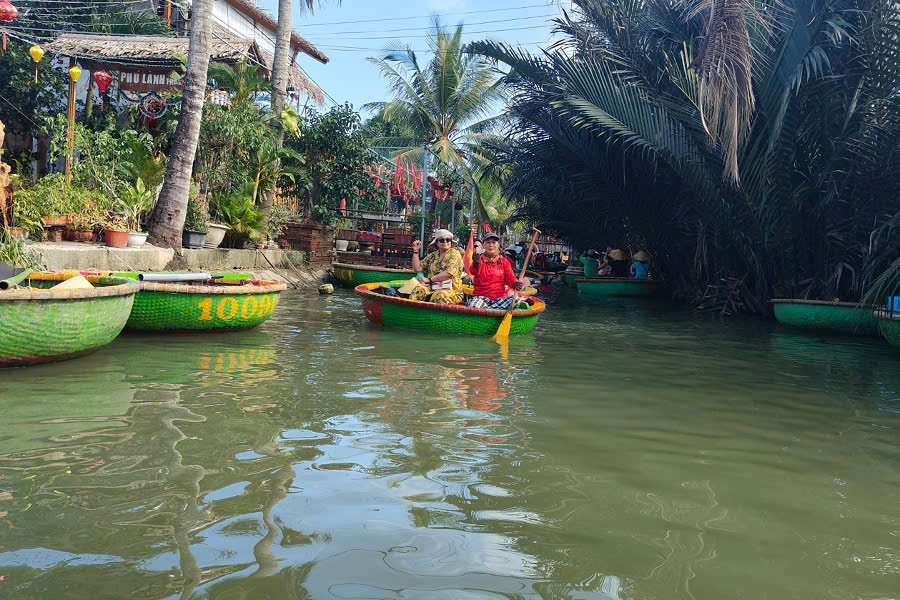 Traditional basket boat ride through the water coconut forest at Cam Thanh Coconut Village near Hoi An