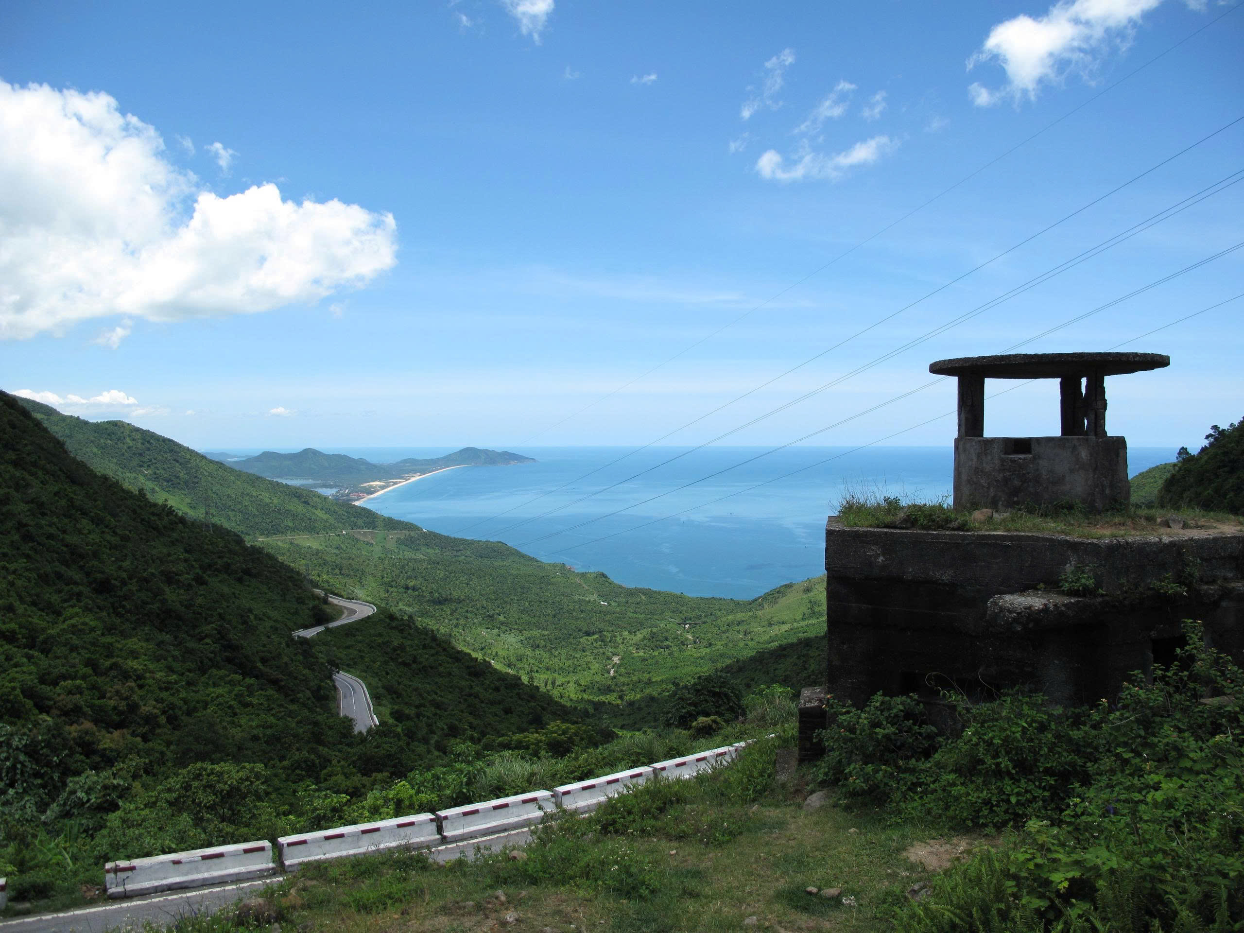 Hai Van Pass winding coastal road with panoramic views of the mountains and sea near Chan May Port