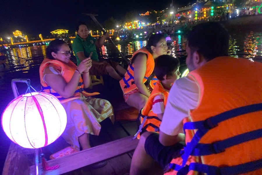 Traditional lantern boat ride on the Hoai River in Hoi An at dusk